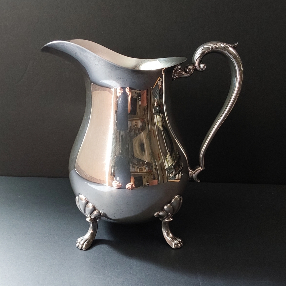 Crescent Footed Pitcher with Ornate Handle
